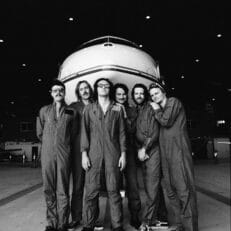 Listen: King Gizzard & The Lizard Wizard Share Second ‘Flight b741’ Single “Hog Calling Contest” and Mini-Documentary “Oink Oink Flight b741: The Making of…”